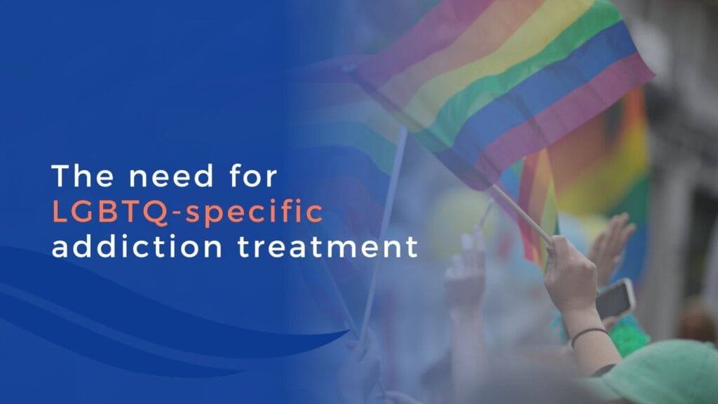 A group of people waving rainbow Pride flags, with text overlay: The need for LGBTQ-specific addiction treatment on a blue background.