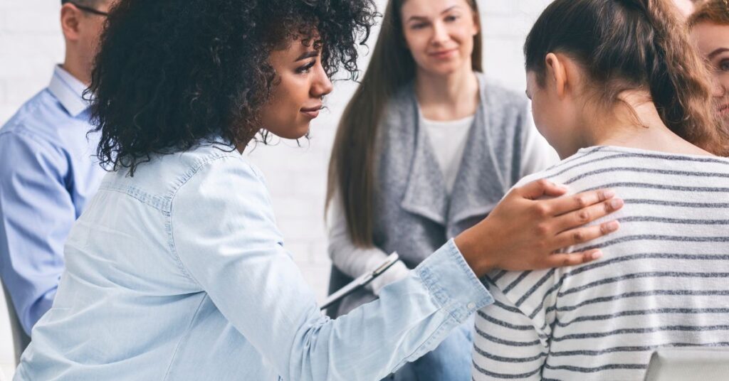 Supportive group therapy session in progress, representing the importance of understanding addiction myths.